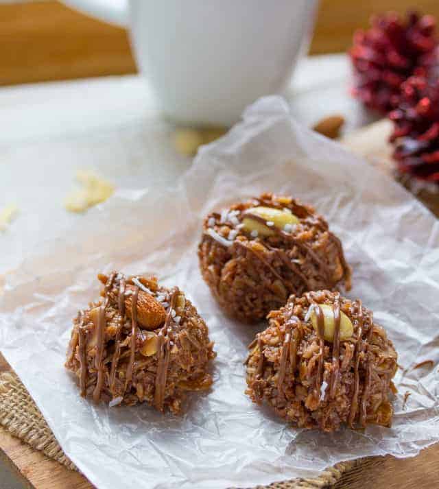 no bake almond joy cookies with christmas decorations in the background