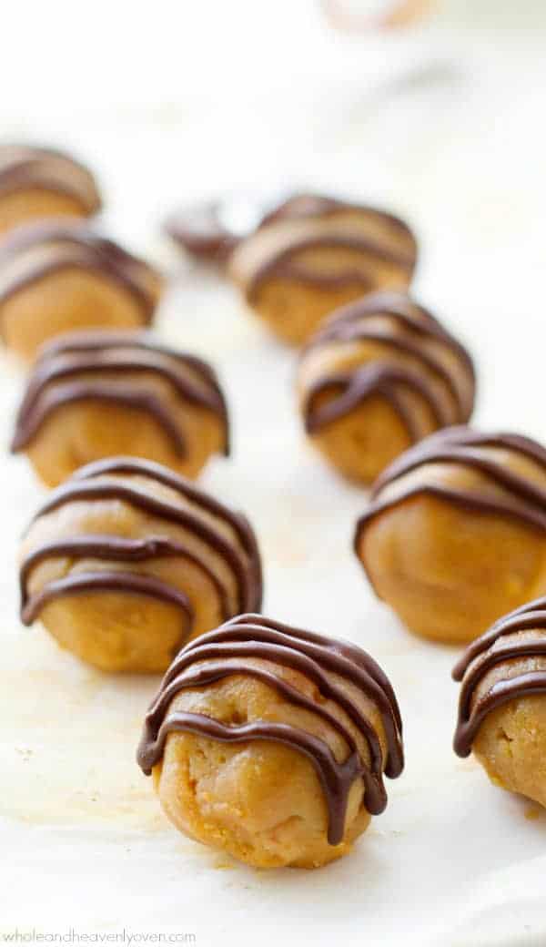 healthy peanut butter cup truffles with chocolate drizzle