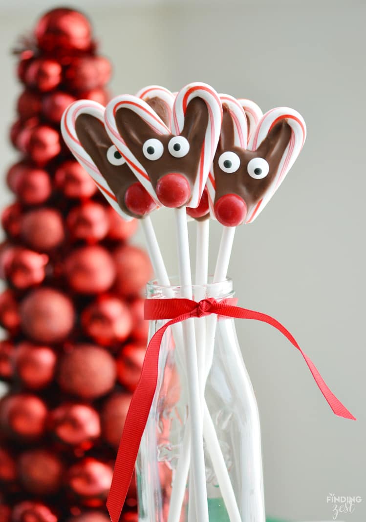 candy cane reindeer pops filled with chocolate and candy eyes