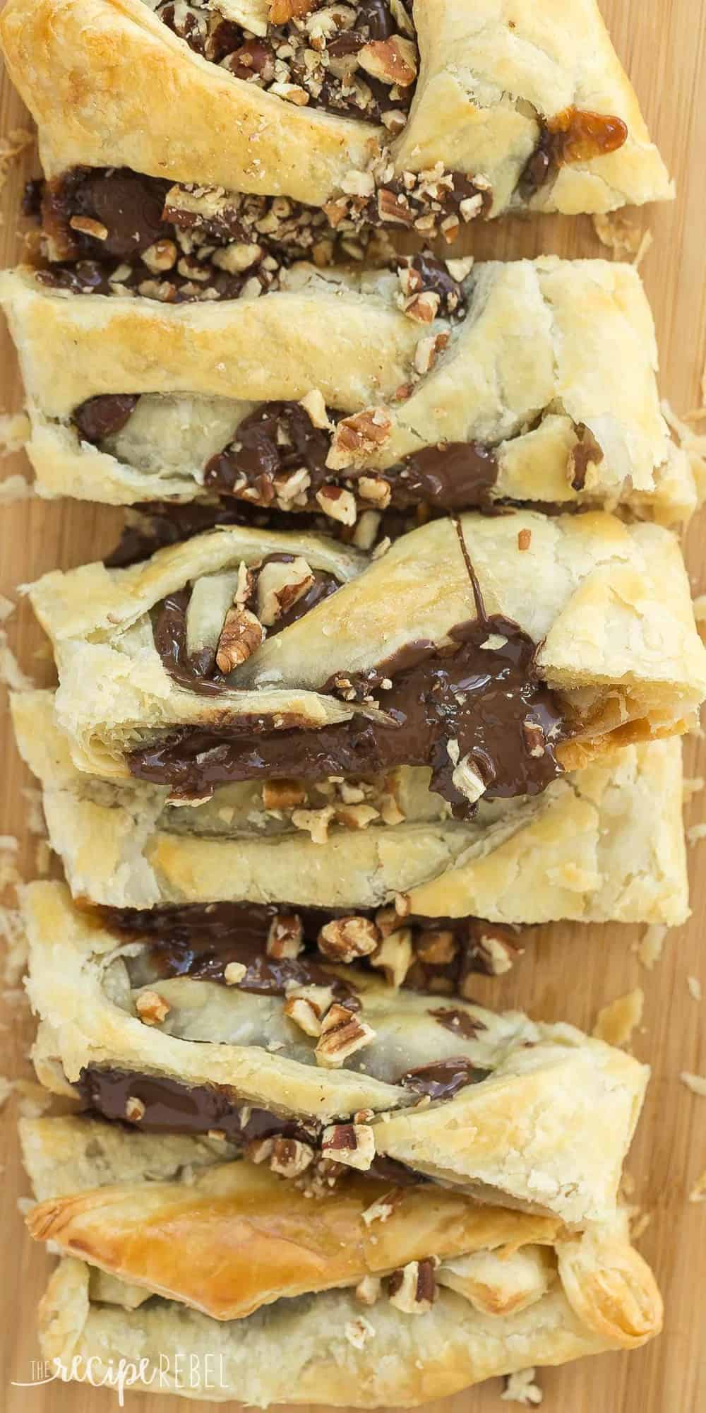 This Easy Turtle Danish is full of chocolate, caramel and pecans! Only a few ingredients but looks so impressive! An easy dessert or special brunch idea! puff pastry turtle danish close up with melted chocolate and chopped pecans
