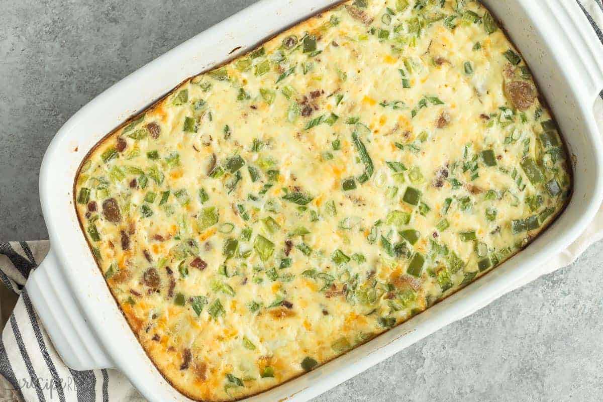 overhead image of white baking dish and finished breakfast casserole