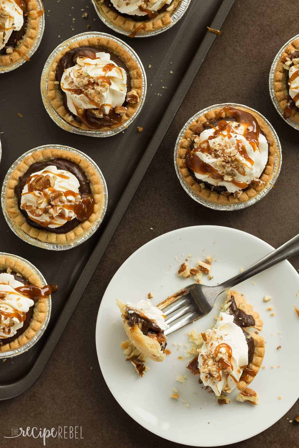 overhead image of mini turtle pudding pies in tart shells some on pan and one unwrapped on plate