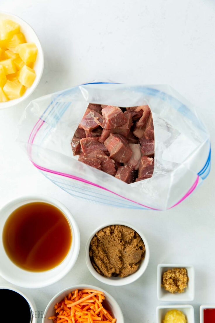 cubes of beef in a ziploc bag ready for coating