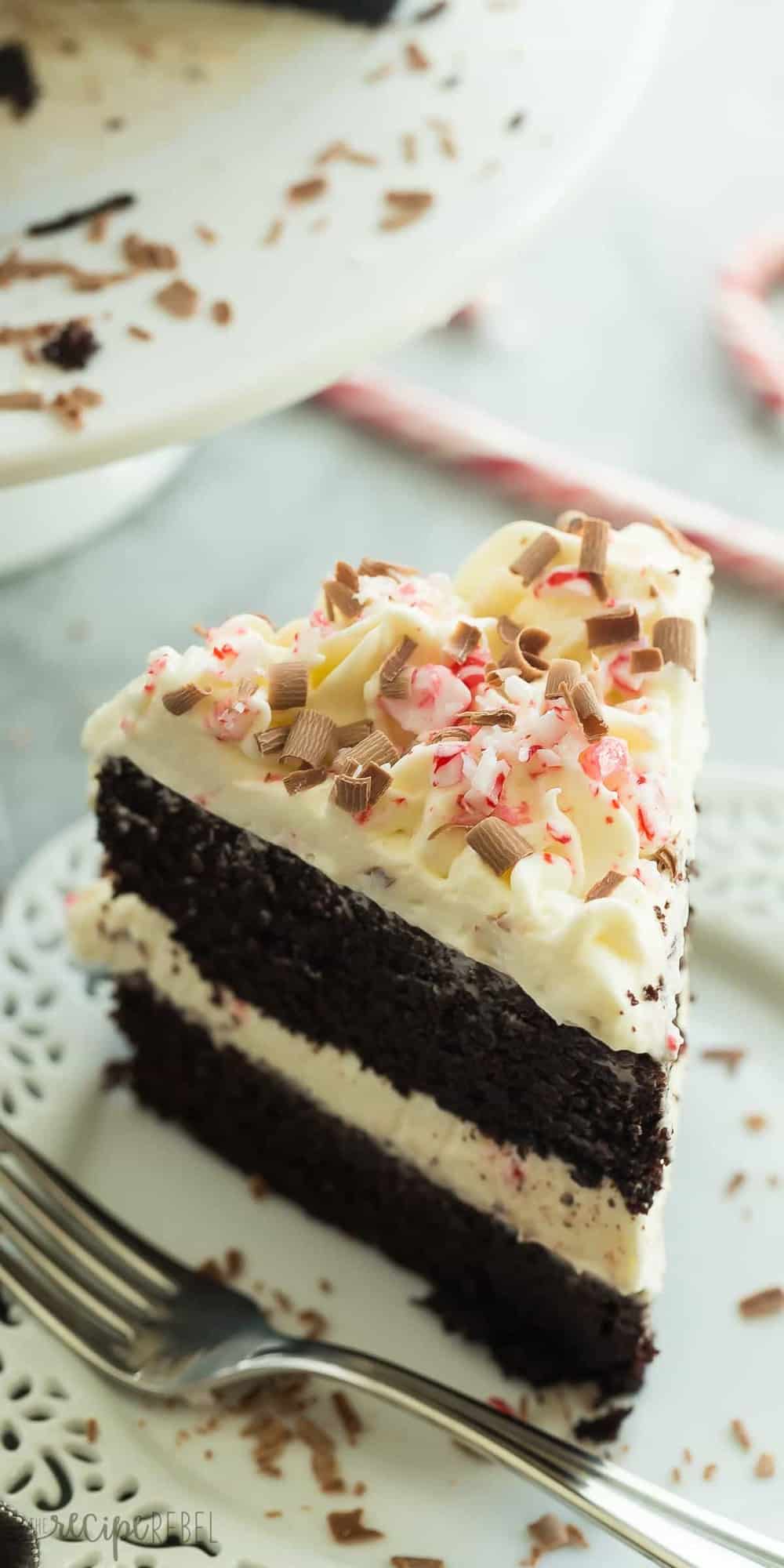 slice of double chocolate peppermint cake on white plate with fork on the side