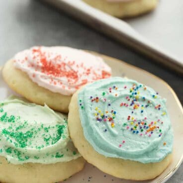 These Sour Cream Sugar Cookies are soft and fluffy with just the right amount of sweetness -- they're perfect with or without frosting and make a great freezer-friendly holiday cookie!
