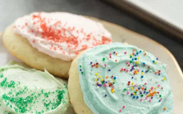 These Sour Cream Sugar Cookies are soft and fluffy with just the right amount of sweetness -- they're perfect with or without frosting and make a great freezer-friendly holiday cookie!