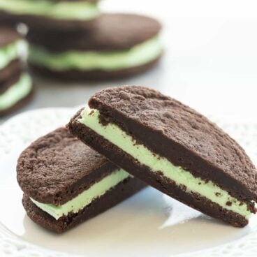 These Homemade Mint Chocolate Oreos have a homemade fudgy chocolate cookie and are filled with mint buttercream. They have the perfect cookie to frosting ratio for sandwich cookies!