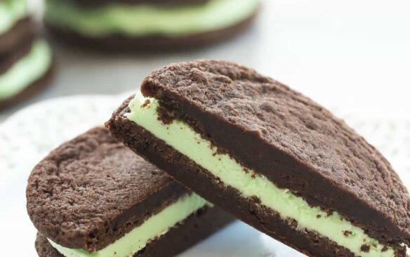 These Homemade Mint Chocolate Oreos have a homemade fudgy chocolate cookie and are filled with mint buttercream. They have the perfect cookie to frosting ratio for sandwich cookies!