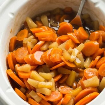 These Slow Cooker Pineapple Glazed Carrots are the perfect side dish for Christmas, Thanksgiving, or any dinner! They are perfectly sweet and tender with a punch of flavor from balsamic vinegar, and they are so easy with the help of the crockpot!