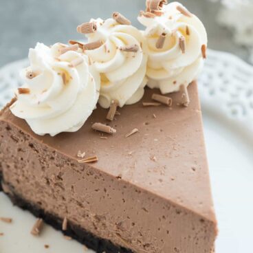 This is the BEST Chocolate Cheesecake! It's perfectly rich, creamy (with the help of Greek yogurt), and bakes up with no cracking and no water bath needed. This is the easy way to perfect baked cheesecake!