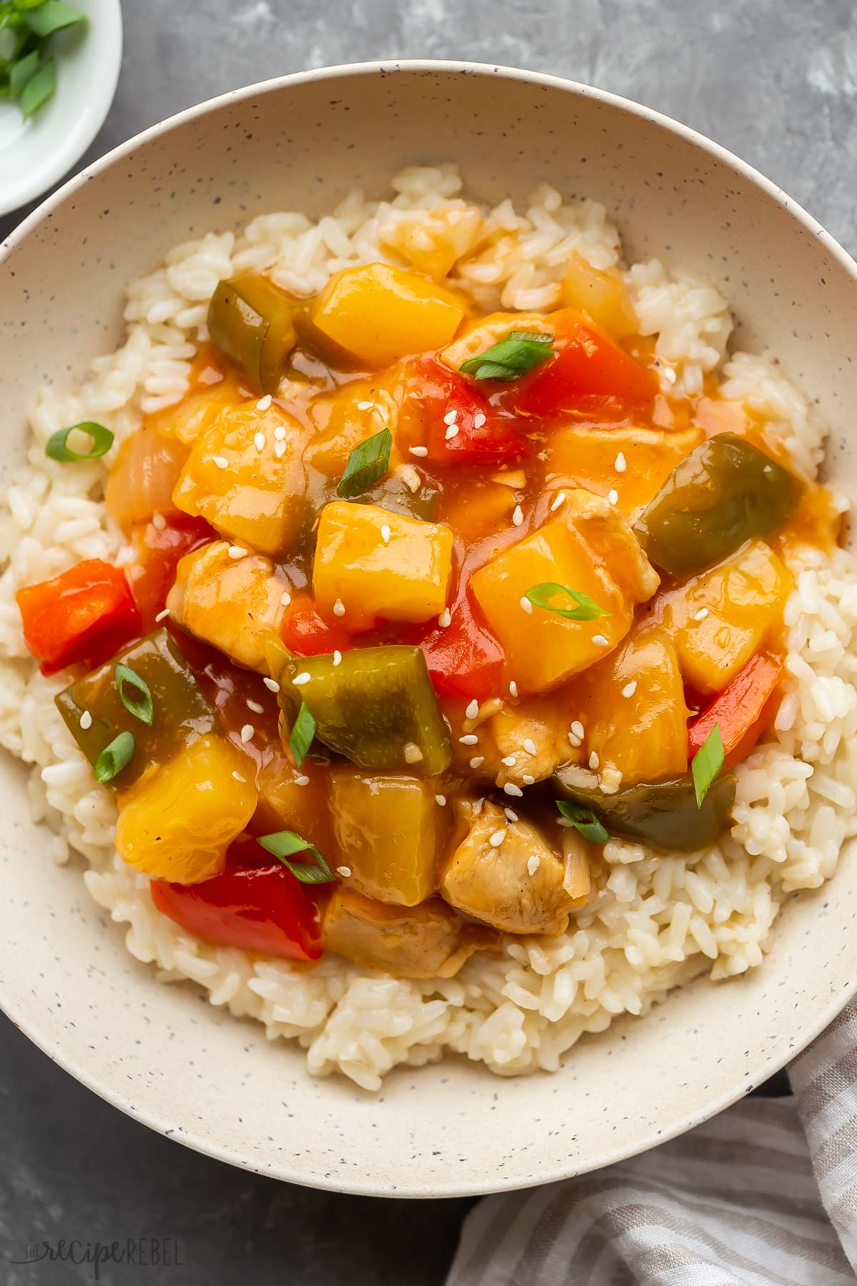 overhead image of instant pot sweet and sour chicken over rice.