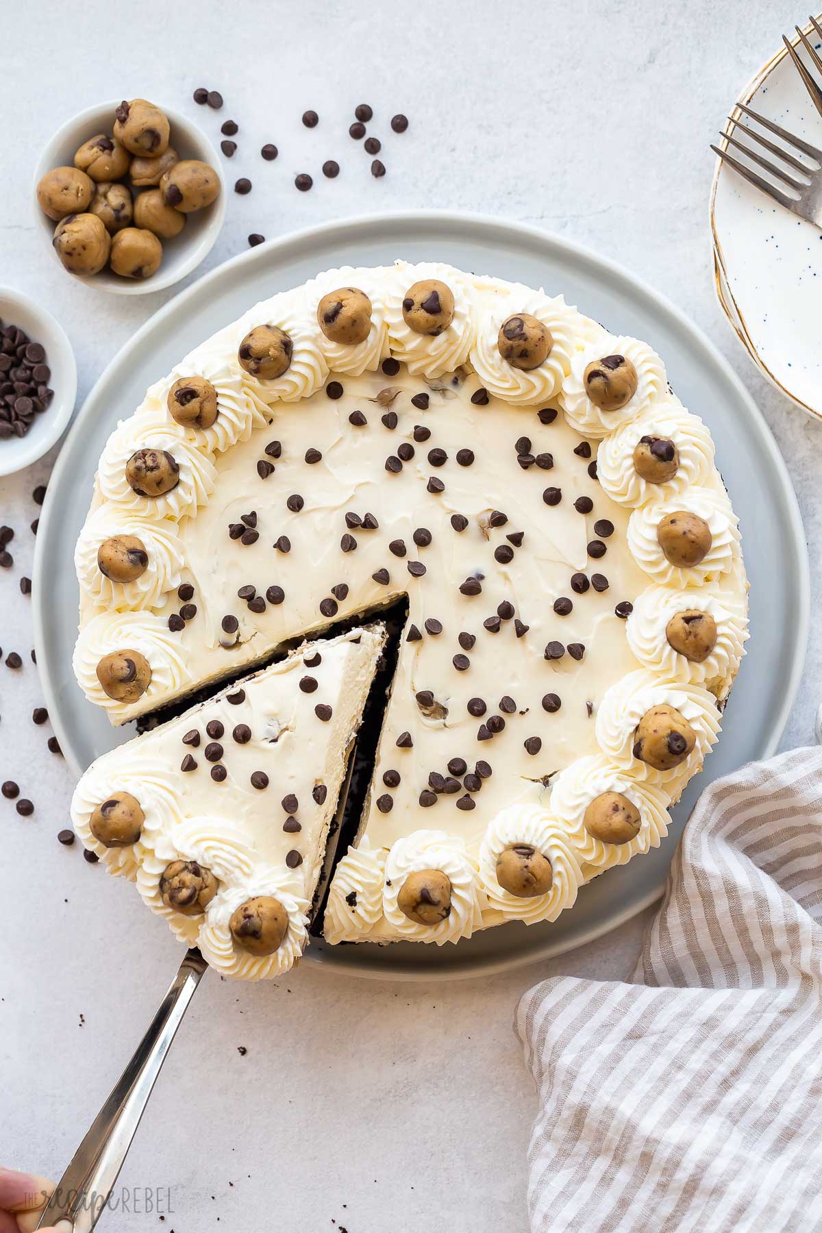 overhead image of cookie dough cheesecake with slice being pulled out.