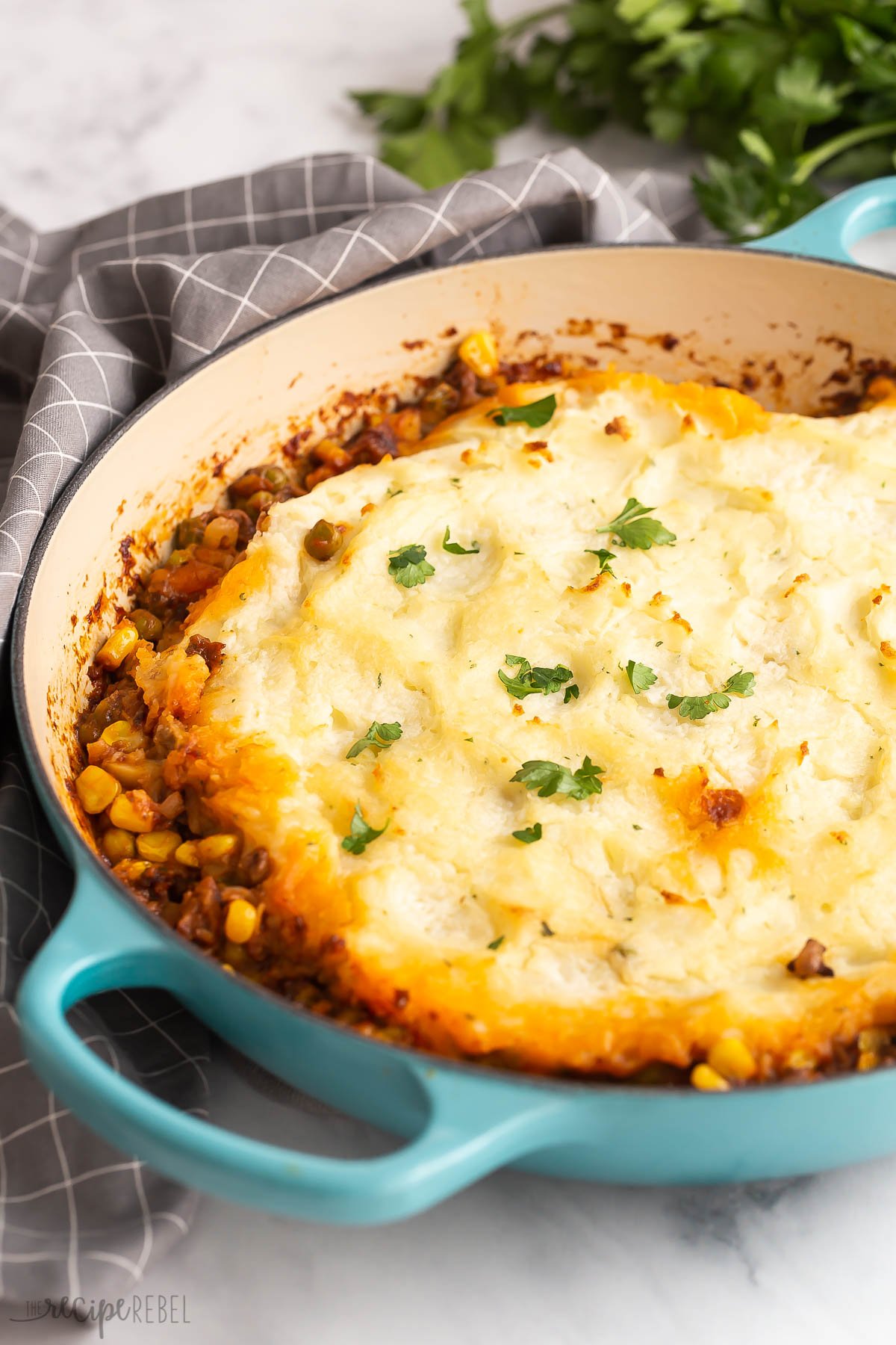 shepherds pie in a blue cast iron skillet.