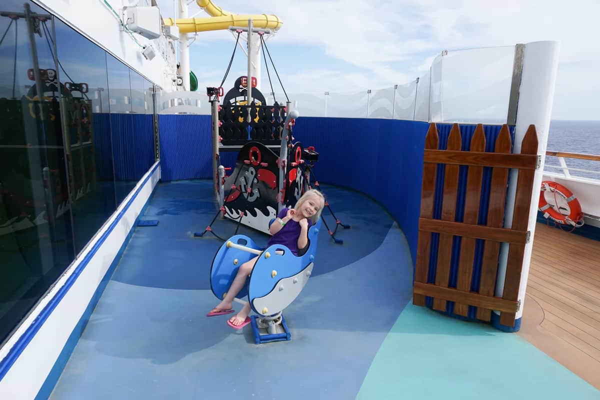 girl playing in playground on carnival sunshine