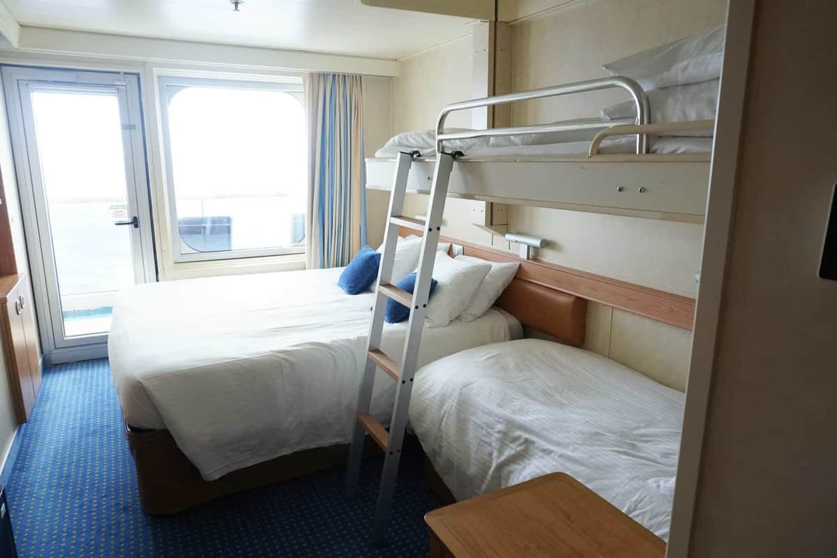 carnival sunshine balcony room with sofa bed and bunk