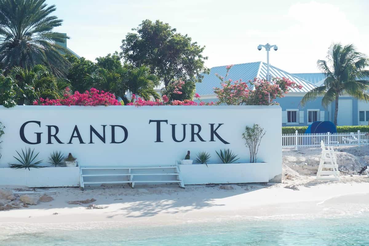 grand turk welcome sign from the dock on the beach