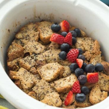 This Overnight Slow Cooker Lemon Poppy Seed French Toast is an easy, overnight breakfast or lunch! It's packed with lemon flavor and topped with fresh berries, perfect for a relaxing weekend breakfast.