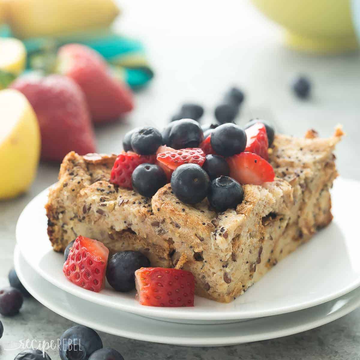 square image of lemon poppy seed overnight french toast on two white plates stacked