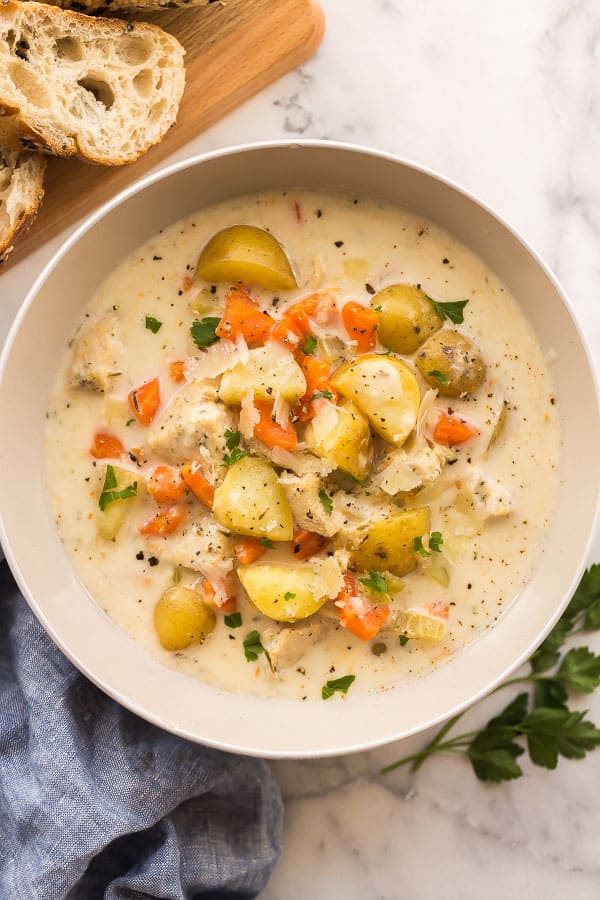 overhead image of creamy chicken stew in bowl