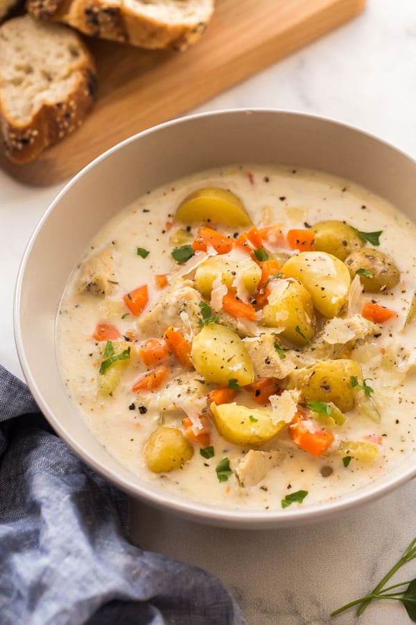 close up image of creamy chicken stew in bowl