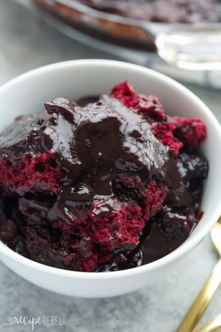 red velvet pudding cake in white bowl with pan in the background