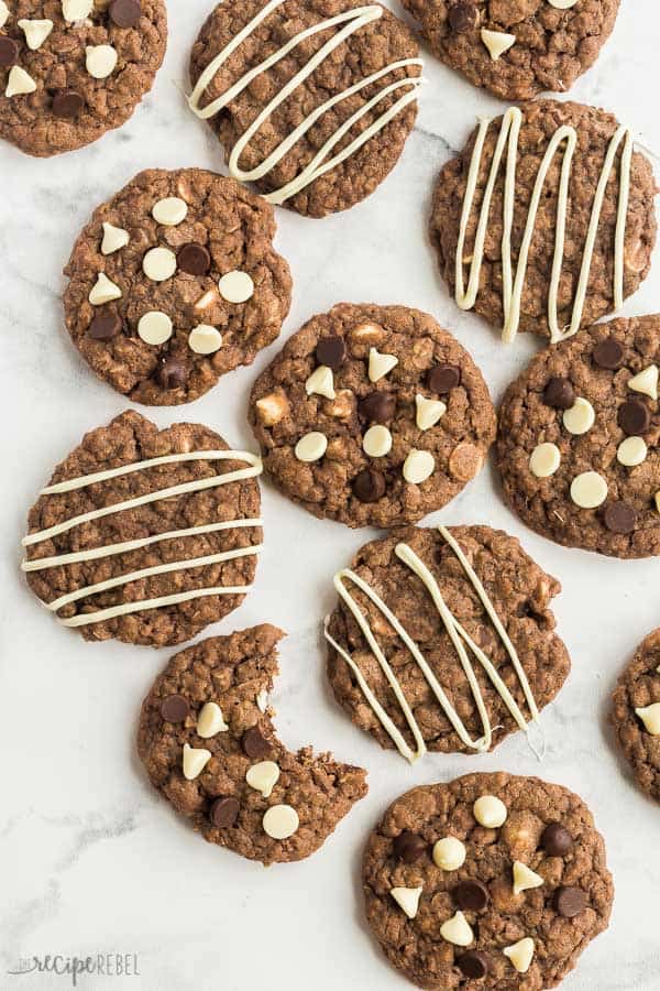 chocolate oatmeal cookies overhead some with chocolate chips and some with white chocolate drizzle