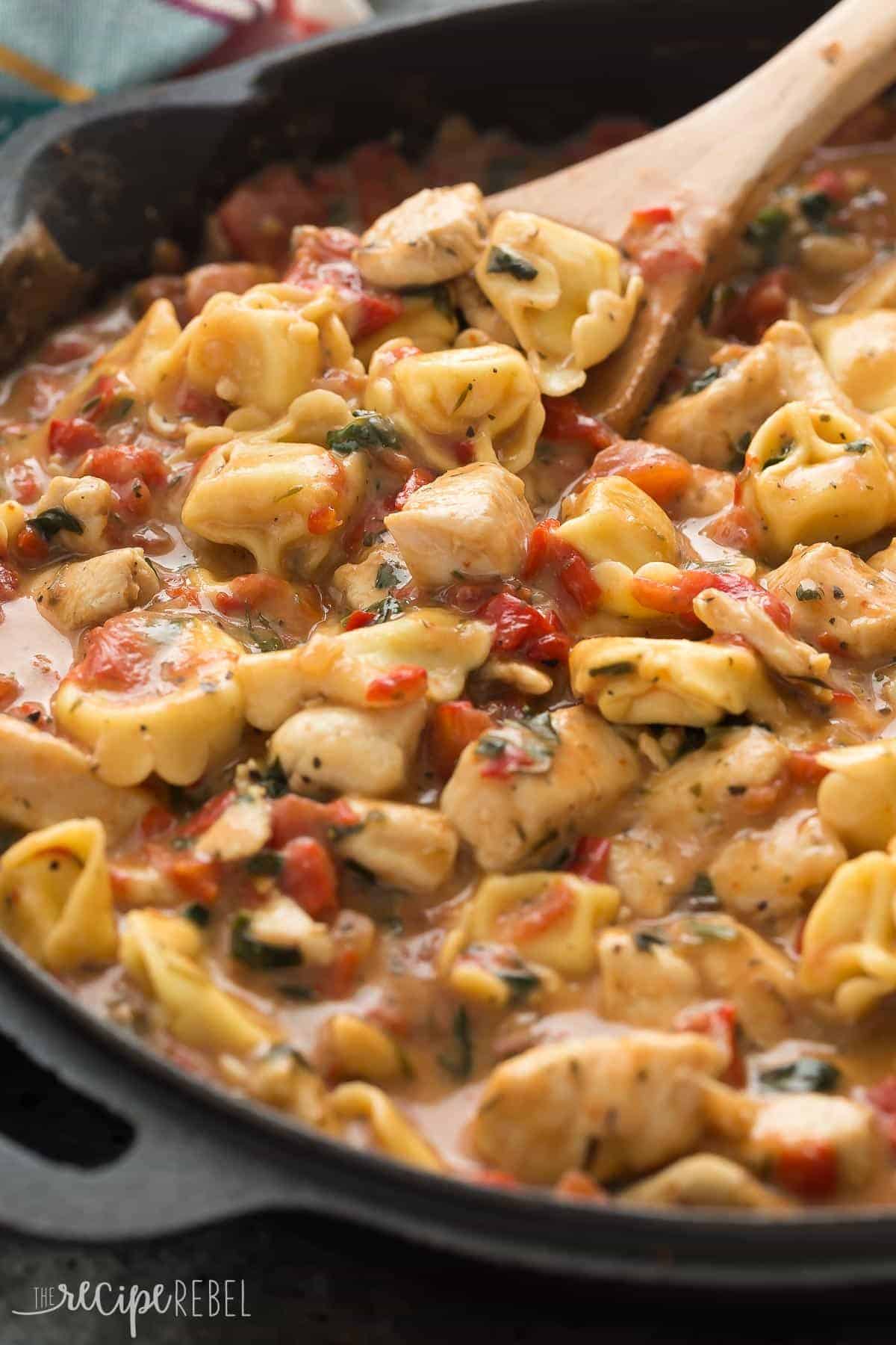 This Italian Chicken Tortellini Skillet is an en easy meal made completely in one pot -- loaded with roasted red peppers, spinach, tomatoes, herbs and cheese!