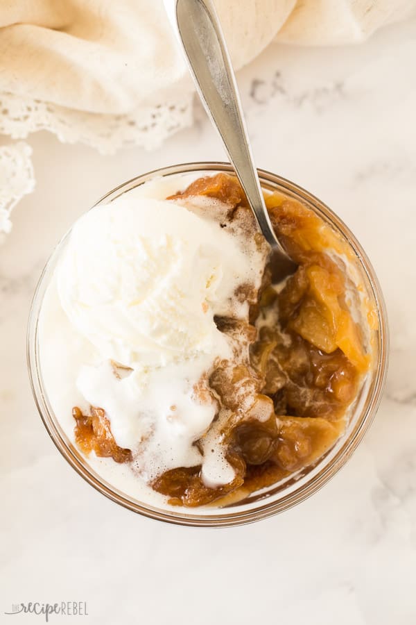 overhead image of caramel apple pudding cake with ice cream melting over