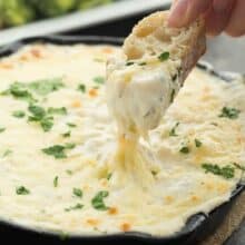 This Cheesy Chicken Alfredo Dip is perfect for game day, movie night, an appetizer or a casual dinner! It’s creamy, cheesy, and made from scratch! Perfect with crusty bread or vegetables.