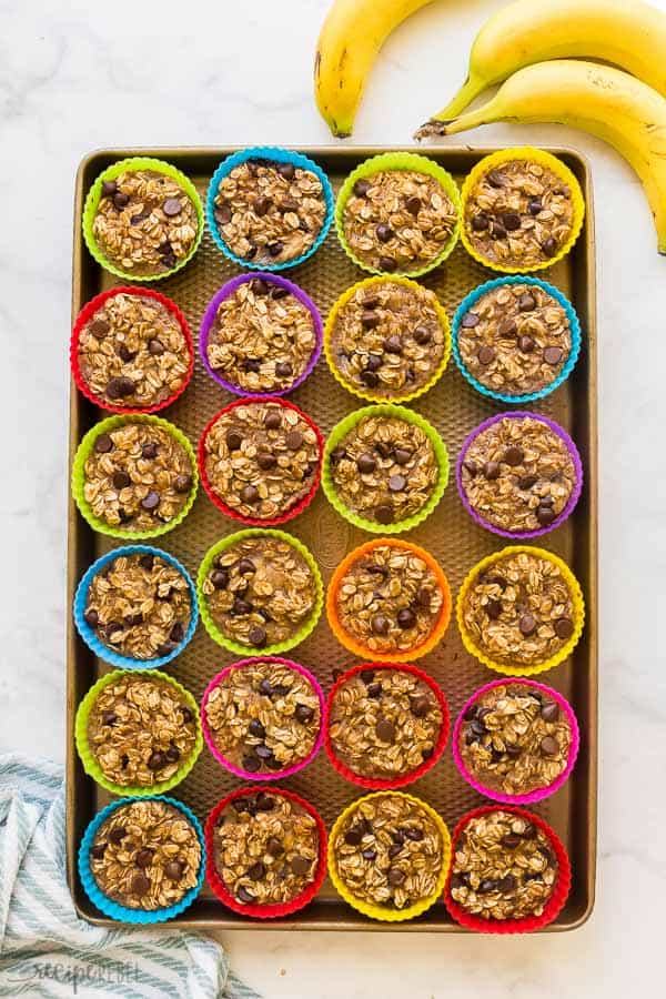 These Banana Chocolate Chip Baked Oatmeal Cups are an easy, healthy breakfast that is make ahead, freezer friendly, and packed with protein and fiber. Includes step by step recipe video #oatmeal #banana #chocolate #oats #healthy #recipe banana chocolate chip baked oatmeal cups in silicone muffin cups