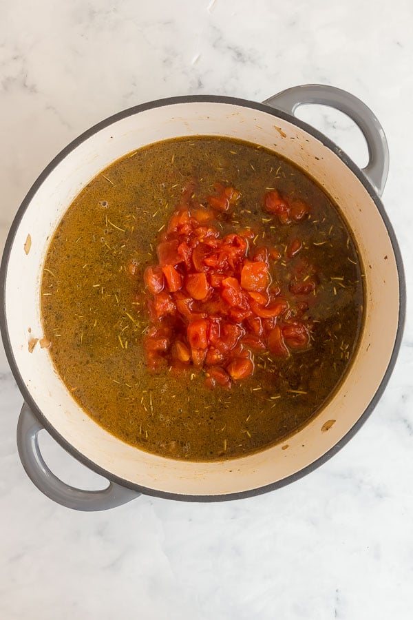 diced tomatoes added to pot for tomato macaroni soup