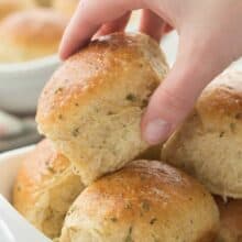 Homemade dinner rolls that are easier than you think, with a step by step recipe video and tons of garlic herb flavor! They're perfectly soft and fluffy. Includes how to recipe video