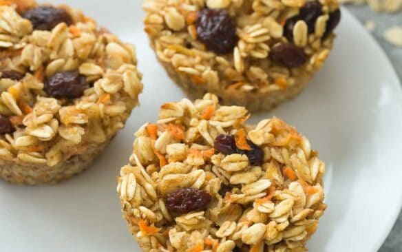 These Carrot Cake Baked Oatmeal Cups are an easy make ahead breakfast that's freezer friendly and easy to customize! Just 100 calories and high in protein and fiber. Includes step by step recipe video. | easy recipe | breakfast | brunch | make ahead | meal prep | healthy recipe | diet | meal planning