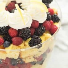 This Lemon Berry Trifle is made up of a homemade Greek Yogurt Lemon Cake, vanilla pudding, whipped cream and piles of fresh berries! It is the perfect summer dessert! Includes step by step recipe video | lemon dessert | spring dessert | easy recipe | Easter | Christmas dessert | baking