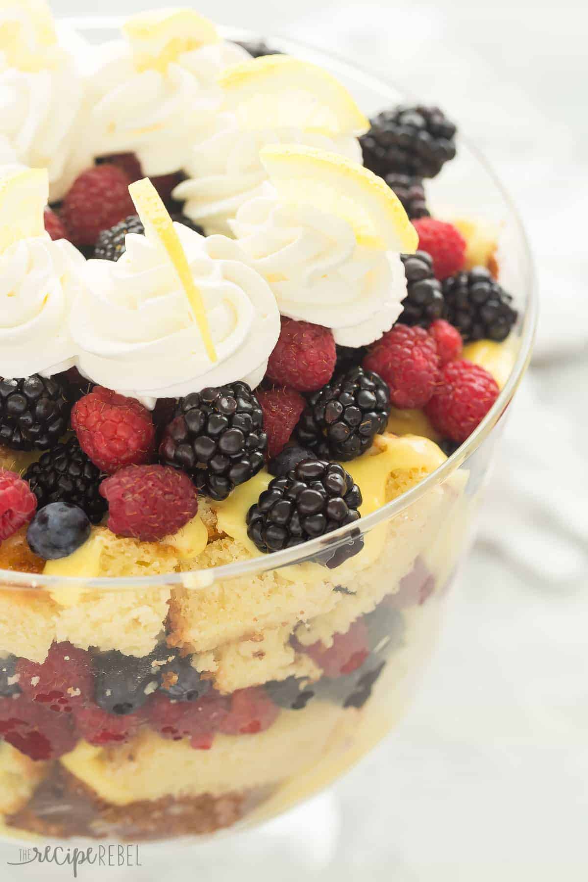 lemon berry trifle close up in glass trifle serving dish with blackberries raspberries and blueberries