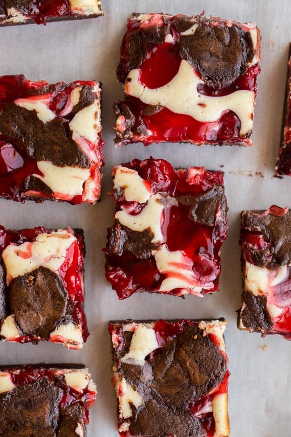 overhead image of cherry cheesecake brownies in squares