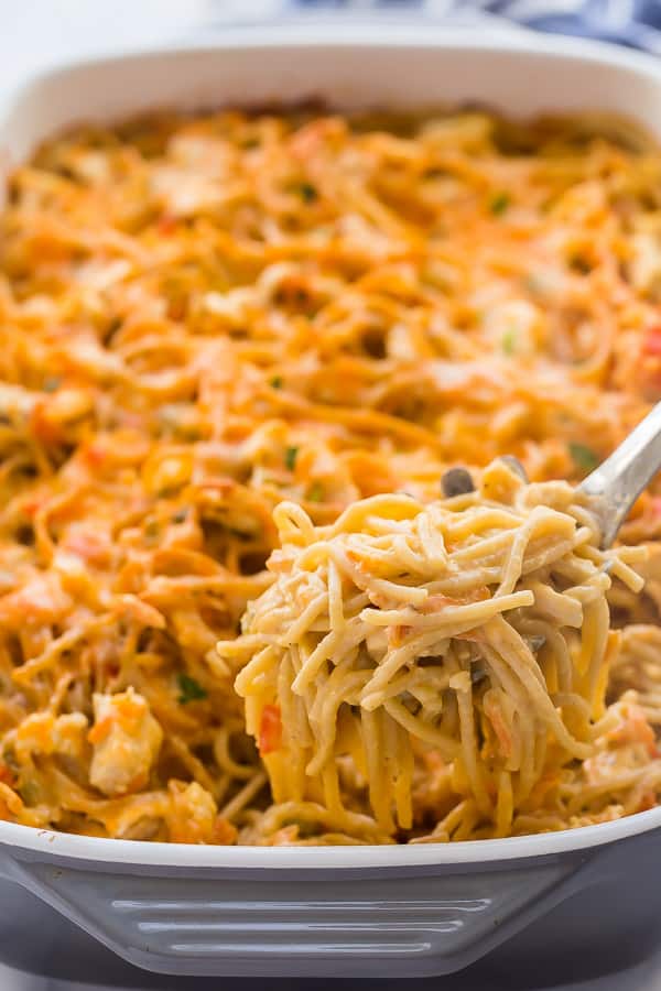 chicken spaghetti being scooped out of pan