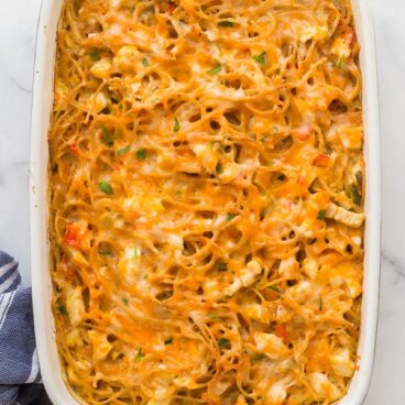 overhead image of chicken spaghetti bake in white dish