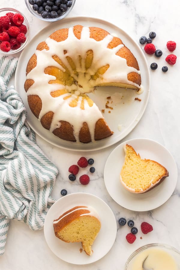 overhead image of lemon bundt cake with two slices on plates