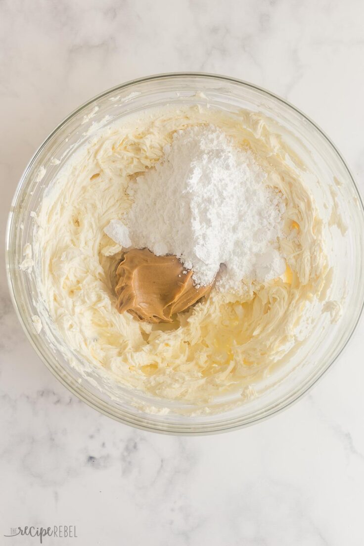 cream cheese in bowl with peanut butter and sugar added