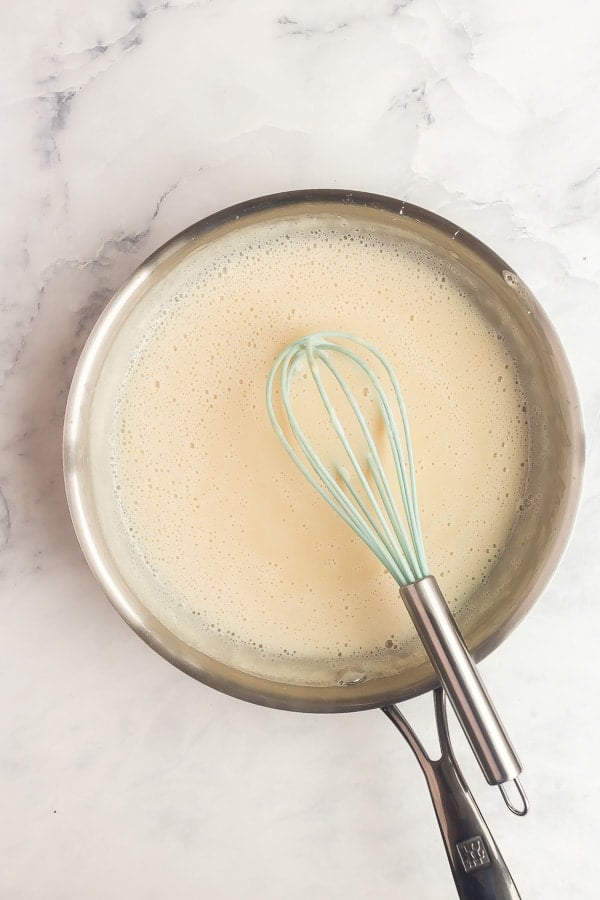 vanilla fruit salad dressing in a stainless steel skillet