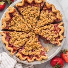 overhead image of whole strawberry pie cut in slices