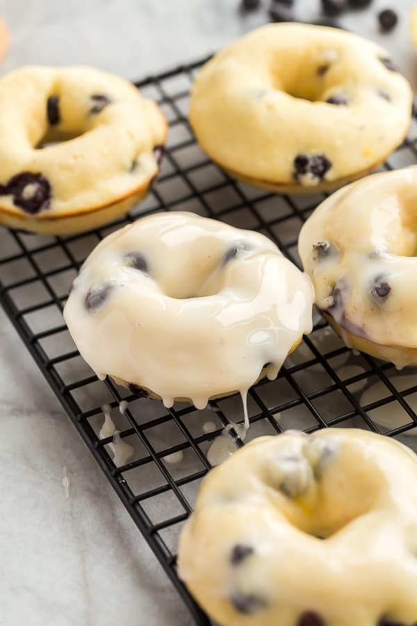 baked donut on cooling rack dripping with glaze