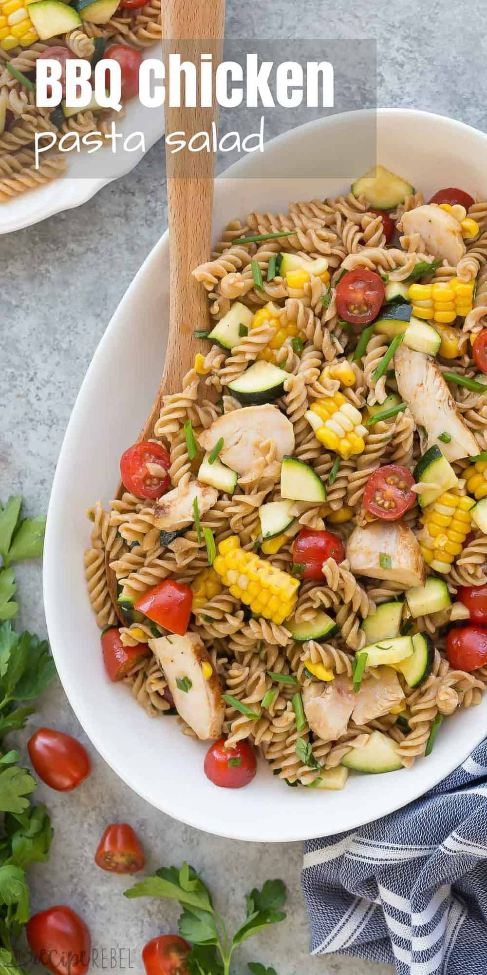 tall overhead image of bbq chicken pasta salad with fresh zucchini corn and tomatoes