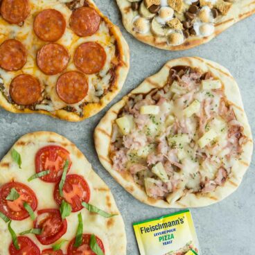 Grilled pizza is an easy summer meal! 4 flavour variations including Pesto Pepperoni, BBQ Hawaiian, Tomato Basil and Banana S'mores -- the ultimate summer dessert pizza! | grilling | summer recipe | barbecue | summer entertaining |