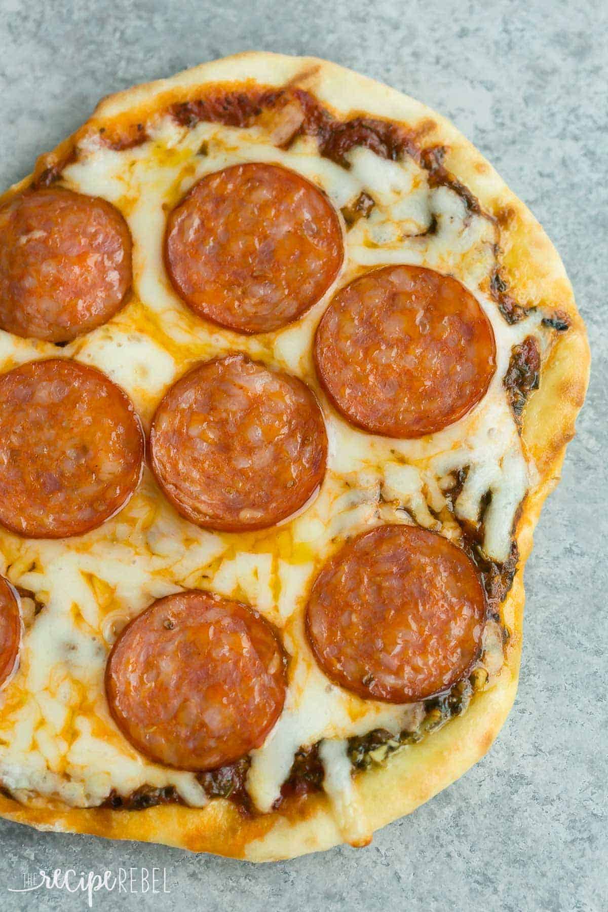 grilled pepperoni pizza on grey background close up