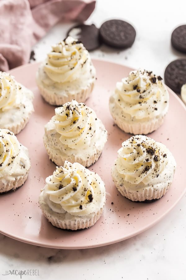 Seven oreo ice cream cupcakes on large pink plate