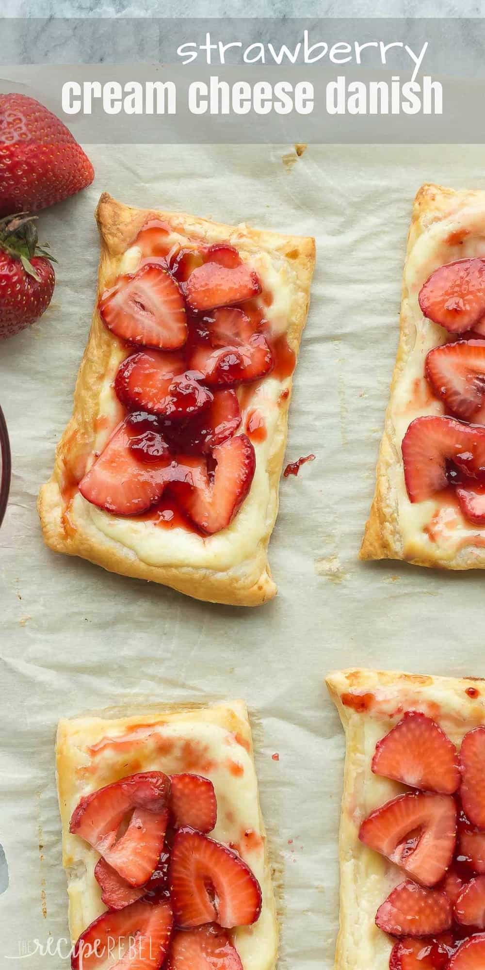 long overhead image of strawberry cream cheese danishes on parchment paper