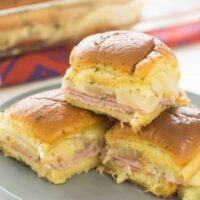 These Hawaiian Ham and Pineapple Sliders are an easy appetizer, lunch or dinner with just a few ingredients. Perfect for a potluck barbecue, game day or a fun weeknight meal! Includes step by step recipe video | easy recipe | game day | superbowl | football | party food | party ideas