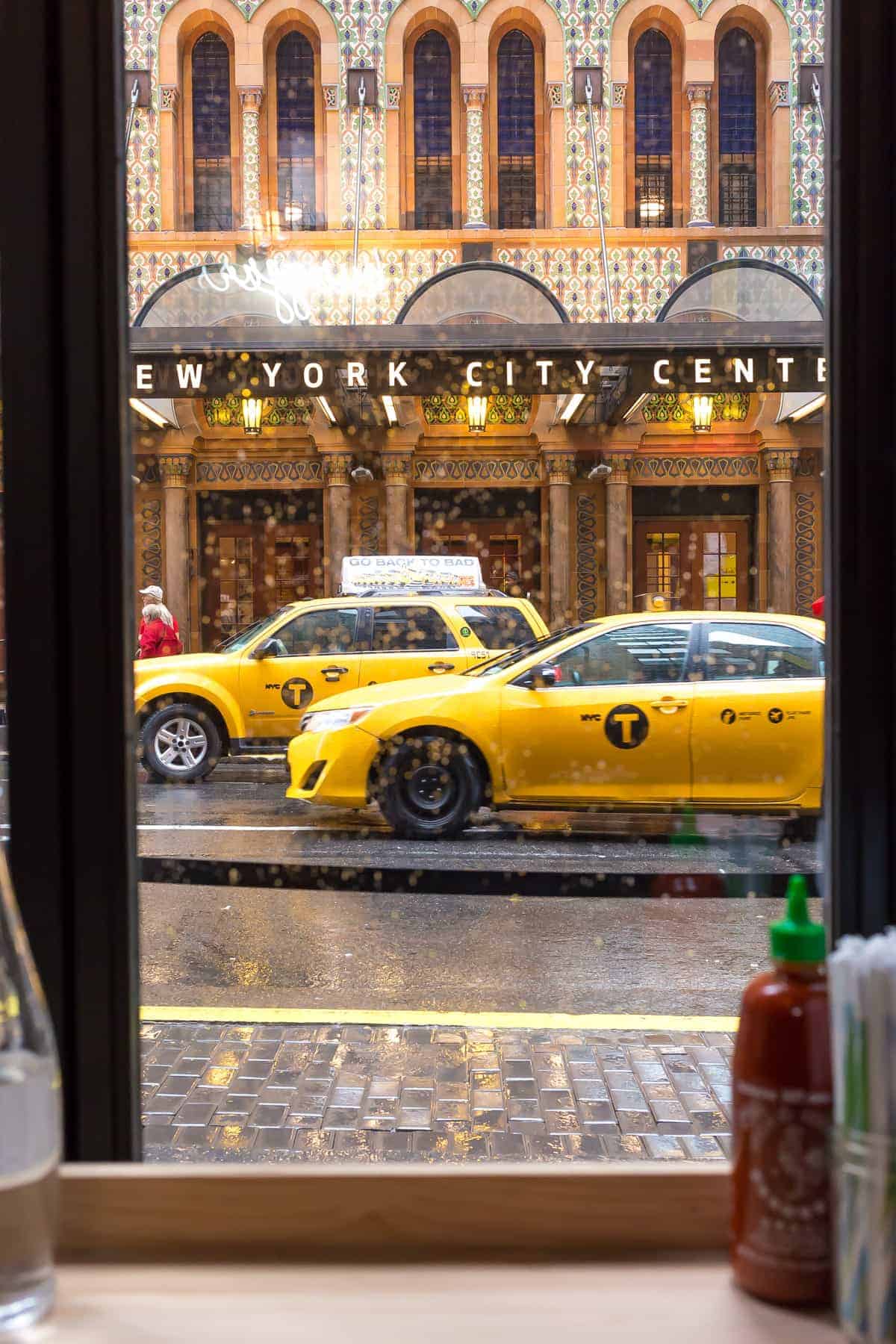 view from black tap new york city of yellow cabs on the street